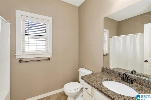 bathroom featuring vanity, a shower with shower curtain, baseboards, tile patterned floors, and toilet