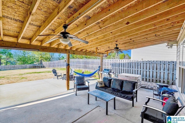 view of patio / terrace featuring a fenced backyard, a trampoline, and ceiling fan