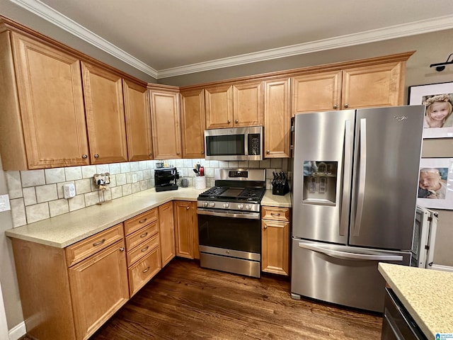 kitchen with ornamental molding, decorative backsplash, stainless steel appliances, and dark wood finished floors