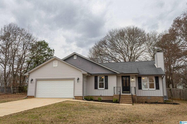 ranch-style home with driveway, fence, an attached garage, crawl space, and a chimney