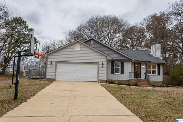 ranch-style house featuring a front yard, driveway, a chimney, a garage, and board and batten siding