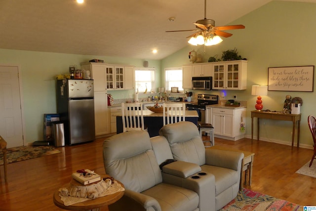1310 County Road 264, Wedowee, AL 36278 - living room with ceiling fan, baseboards, lofted ceiling, and wood finished floors