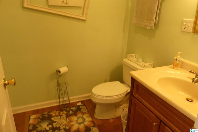 1310 County Road 264, Wedowee, AL 36278 - half bath featuring toilet, vanity, baseboards, and wood finished floors