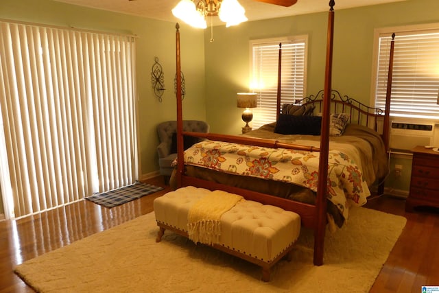 1310 County Road 264, Wedowee, AL 36278 - bedroom with a ceiling fan, wood finished floors, and a wall mounted air conditioner