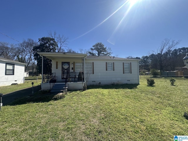 view of front of house with crawl space, covered porch, and a front lawn