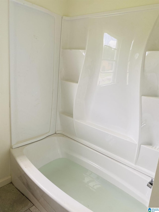 bathroom featuring a tub to relax in