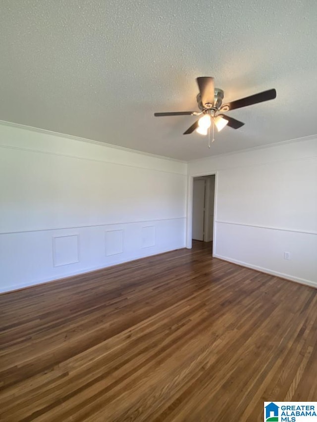 unfurnished room with a ceiling fan, dark wood-style floors, and a textured ceiling