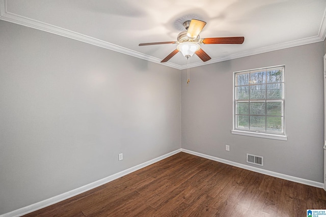 unfurnished room with visible vents, dark wood finished floors, crown molding, baseboards, and ceiling fan