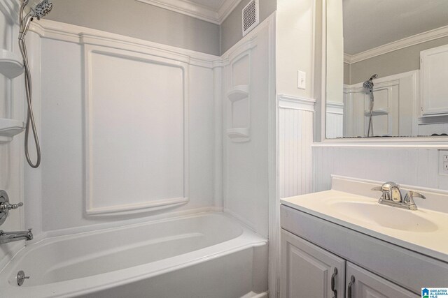 bathroom featuring shower / bath combination, visible vents, ornamental molding, and vanity