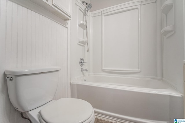 bathroom featuring toilet and bathing tub / shower combination