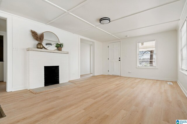 264 Mccalla Rd, Birmingham, AL 35022 - unfurnished living room featuring visible vents, baseboards, wood finished floors, and a fireplace