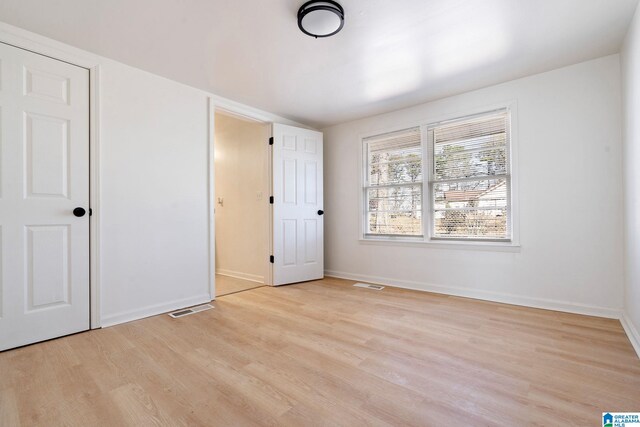 264 Mccalla Rd, Birmingham, AL 35022 - unfurnished bedroom with light wood-style floors, visible vents, and baseboards