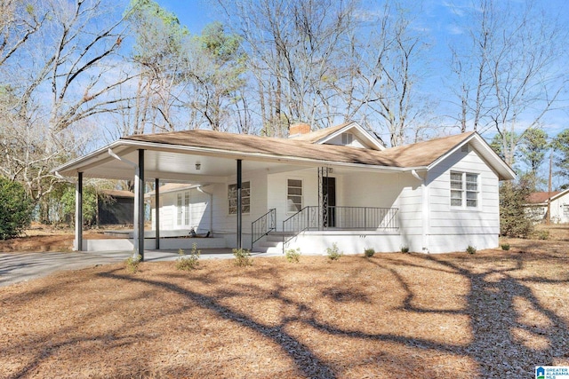 264 Mccalla Rd, Birmingham, AL 35022 - view of front of property featuring a carport, a porch, driveway, and a chimney