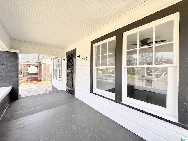 view of patio with a fireplace