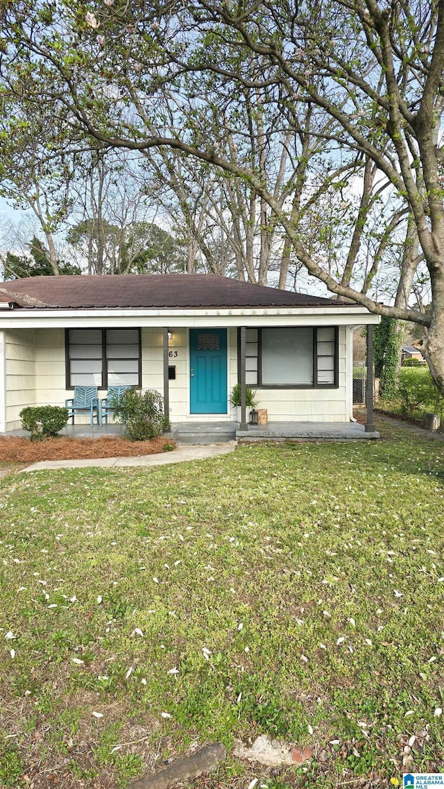 563 Brussels Ave, Birmingham, AL 35212 - ranch-style home with a front yard and concrete block siding