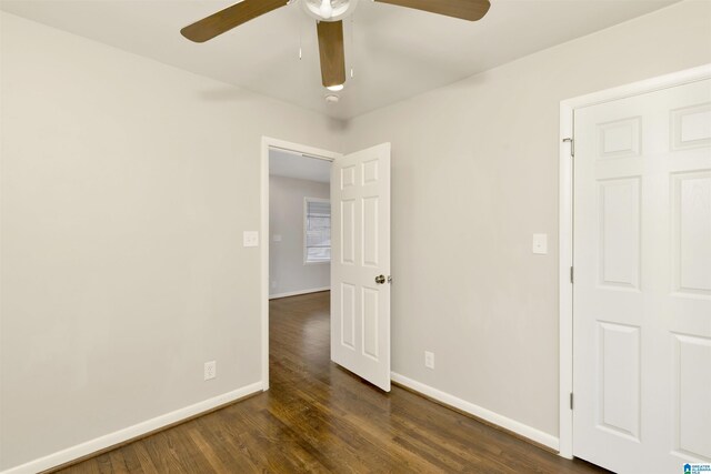 563 Brussels Ave, Birmingham, AL 35212 - empty room with dark wood-style floors, baseboards, and ceiling fan