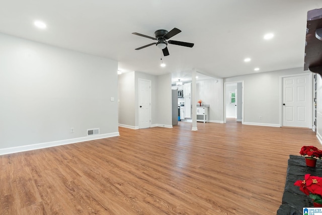 unfurnished living room featuring visible vents, recessed lighting, light wood-style floors, baseboards, and ceiling fan