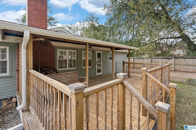 wooden deck featuring a ceiling fan and fence