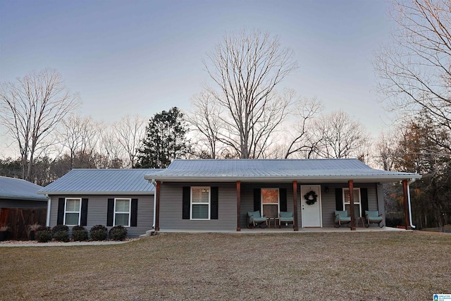 2365 Jim Raney Ln, Bessemer, AL 35023 - single story home with a front lawn, covered porch, and metal roof