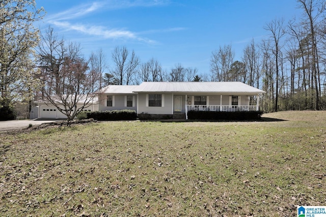 2350 Morton Rd, Warrior, AL 35180 - single story home featuring metal roof, a garage, a porch, and a front yard