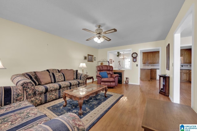 2350 Morton Rd, Warrior, AL 35180 - living room with baseboards, light wood-style floors, and ceiling fan