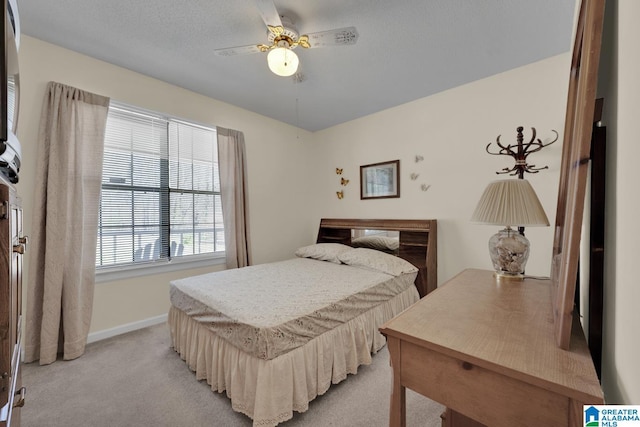 2350 Morton Rd, Warrior, AL 35180 - bedroom featuring light colored carpet, baseboards, and a ceiling fan