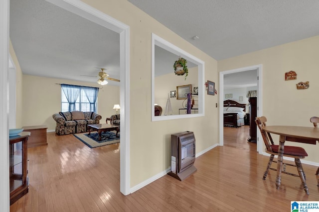 2350 Morton Rd, Warrior, AL 35180 - hallway with baseboards, wood-type flooring, and a textured ceiling