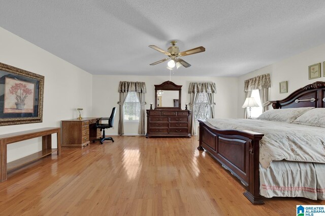 2350 Morton Rd, Warrior, AL 35180 - bedroom featuring light wood-style flooring, a textured ceiling, and baseboards