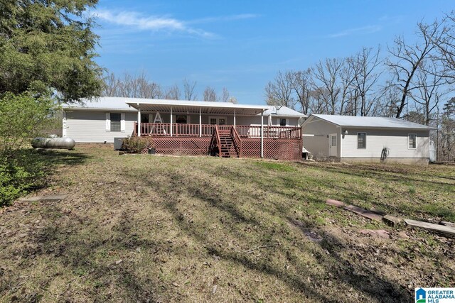 2350 Morton Rd, Warrior, AL 35180 - back of property with a wooden deck and a lawn