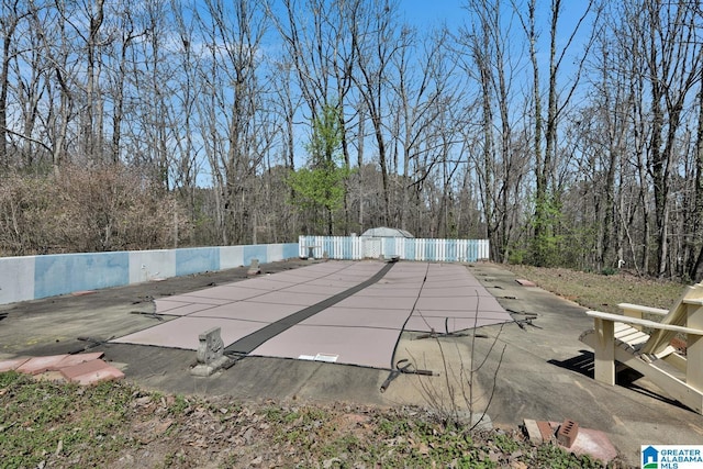 2350 Morton Rd, Warrior, AL 35180 - view of pool featuring a view of trees, a patio, and fence