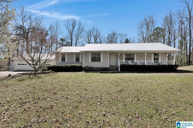 2350 Morton Rd, Warrior, AL 35180 - single story home with covered porch, driveway, metal roof, and a front lawn