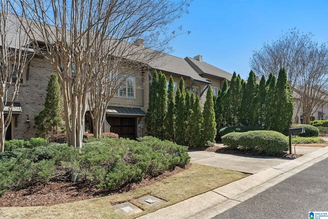 obstructed view of property featuring a chimney