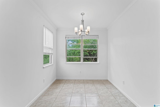unfurnished dining area with a chandelier, baseboards, and crown molding