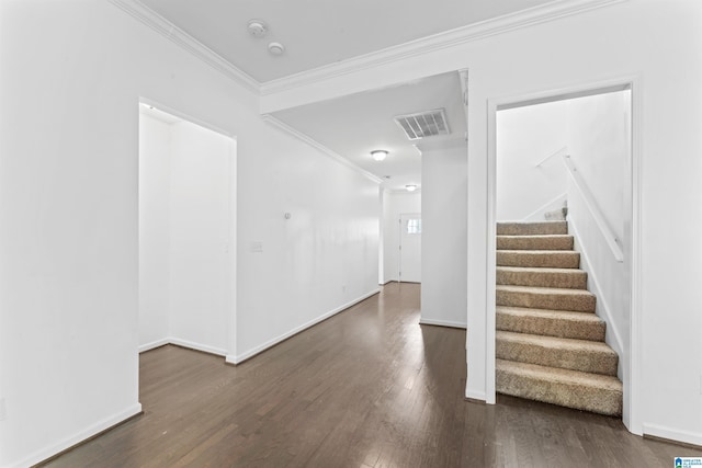entrance foyer with stairway, ornamental molding, and wood finished floors