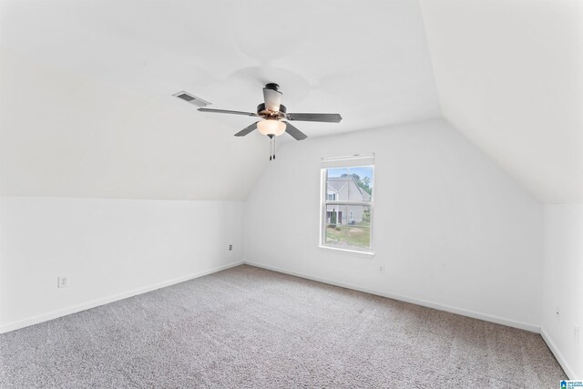 bonus room featuring visible vents, ceiling fan, vaulted ceiling, and carpet floors