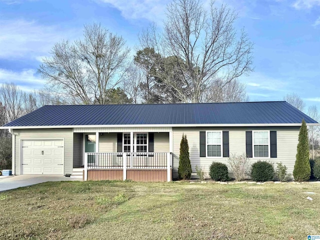 single story home with a porch, an attached garage, driveway, and metal roof