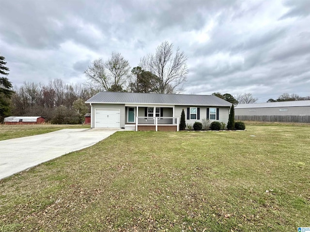 ranch-style home featuring metal roof, a garage, a porch, and driveway