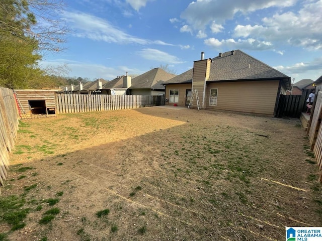 view of yard featuring a patio area and a fenced backyard