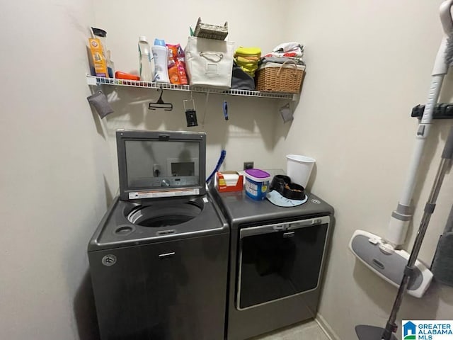 laundry room featuring washer and dryer and laundry area