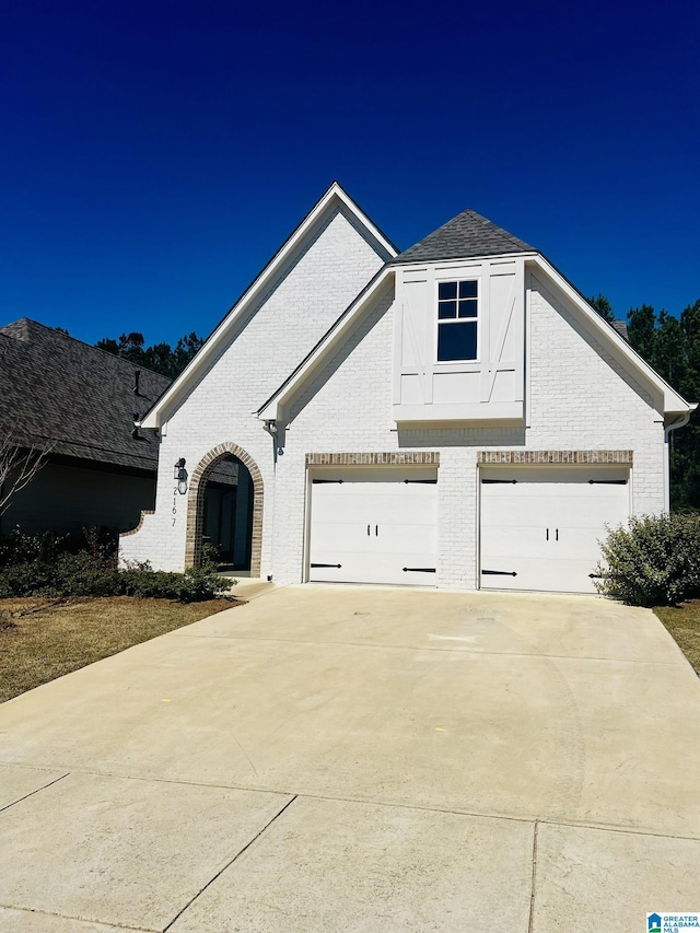 2167 Springfield Dr, Chelsea, AL 35043 - view of front of property featuring an attached garage, brick siding, and concrete driveway