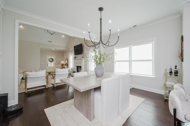 2167 Springfield Dr, Chelsea, AL 35043 - dining space featuring ornamental molding, baseboards, a fireplace, and dark wood finished floors