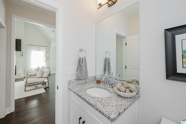 2167 Springfield Dr, Chelsea, AL 35043 - bathroom featuring vanity, lofted ceiling, and wood finished floors