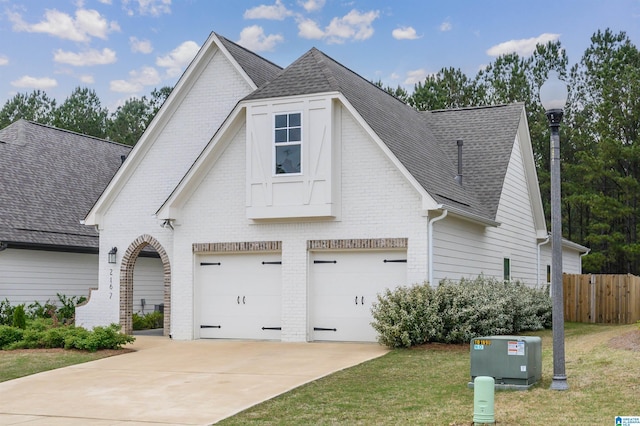 2167 Springfield Dr, Chelsea, AL 35043 - view of front of property featuring driveway, brick siding, a shingled roof, and fence