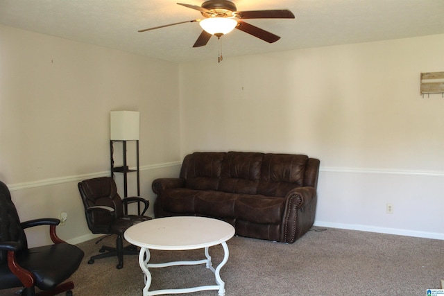 living room featuring baseboards, a ceiling fan, and carpet floors