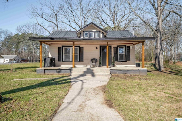 1109 Central Ave, Gadsden, AL 35904 - bungalow-style home featuring a porch, a front yard, and metal roof