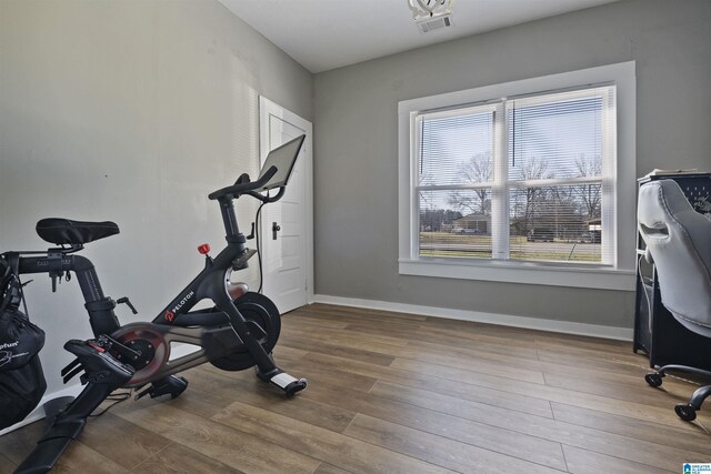 1109 Central Ave, Gadsden, AL 35904 - exercise room with visible vents, baseboards, and wood finished floors
