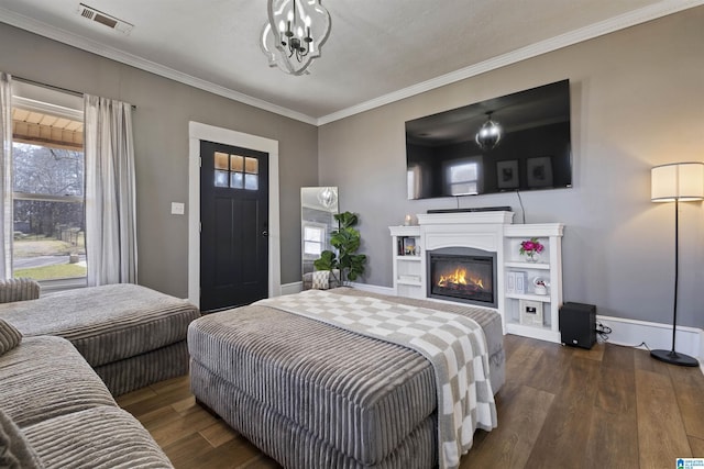 1109 Central Ave, Gadsden, AL 35904 - bedroom with visible vents, multiple windows, baseboards, and dark wood-style flooring
