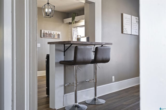 1109 Central Ave, Gadsden, AL 35904 - interior space featuring baseboards, a notable chandelier, and dark wood-style flooring