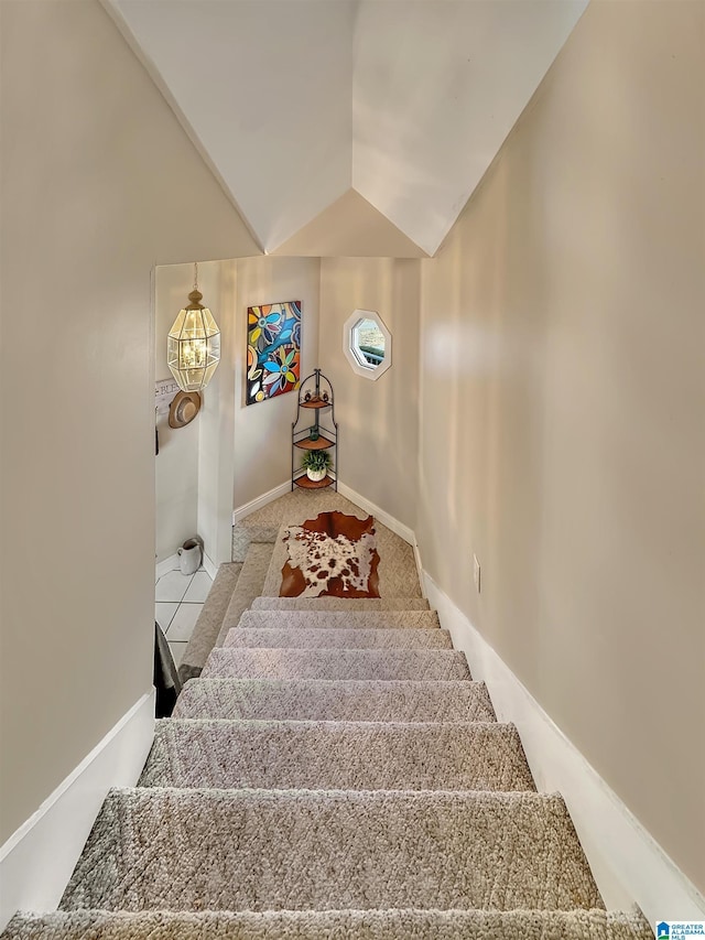 385 Rouse Rd, Sumiton, AL 35148 - stairway featuring baseboards and vaulted ceiling