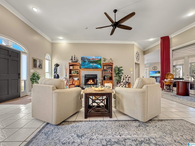 385 Rouse Rd, Sumiton, AL 35148 - living room with crown molding, a ceiling fan, and a lit fireplace